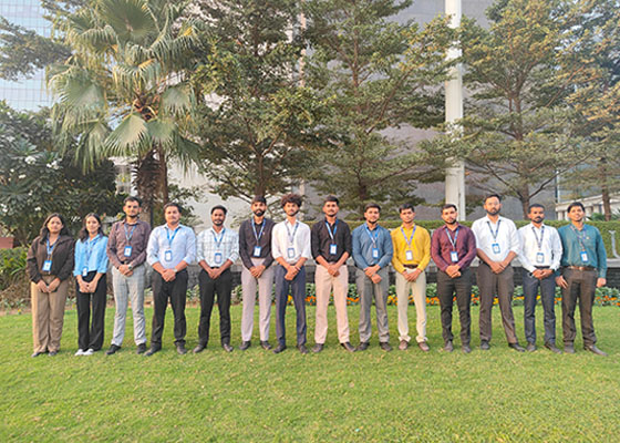 Group photo of internship students outdoors.