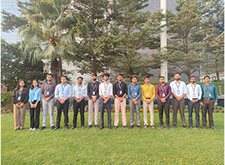 Group photo of internship students outdoors.