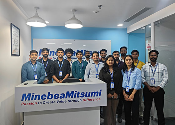 Group photo of internship students indoors.