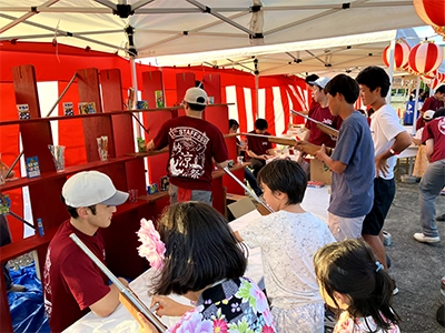 Scene 2 from the summer festival: Target shooting game