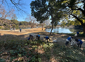 Employees and their families participating in a cleanup activity.