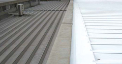 image : Portion of roof uncoated (black area on left) Portion of roof coated with heat shield paint (white area on right)
