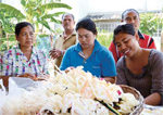 image : Local community members make artificial flowers