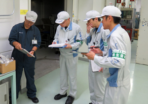 image : Employees conduct a safety patrol